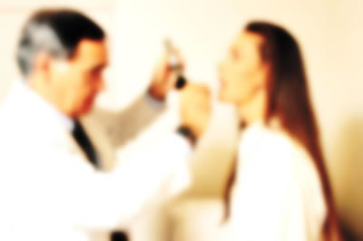 Blurry photo of doctor and patient.