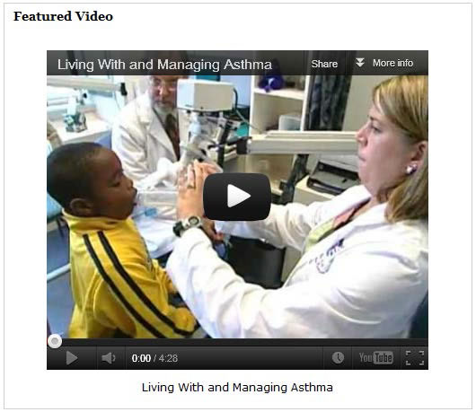 Screenshot of a video about asthma, showing a doctor checking a little boy's breathing.
